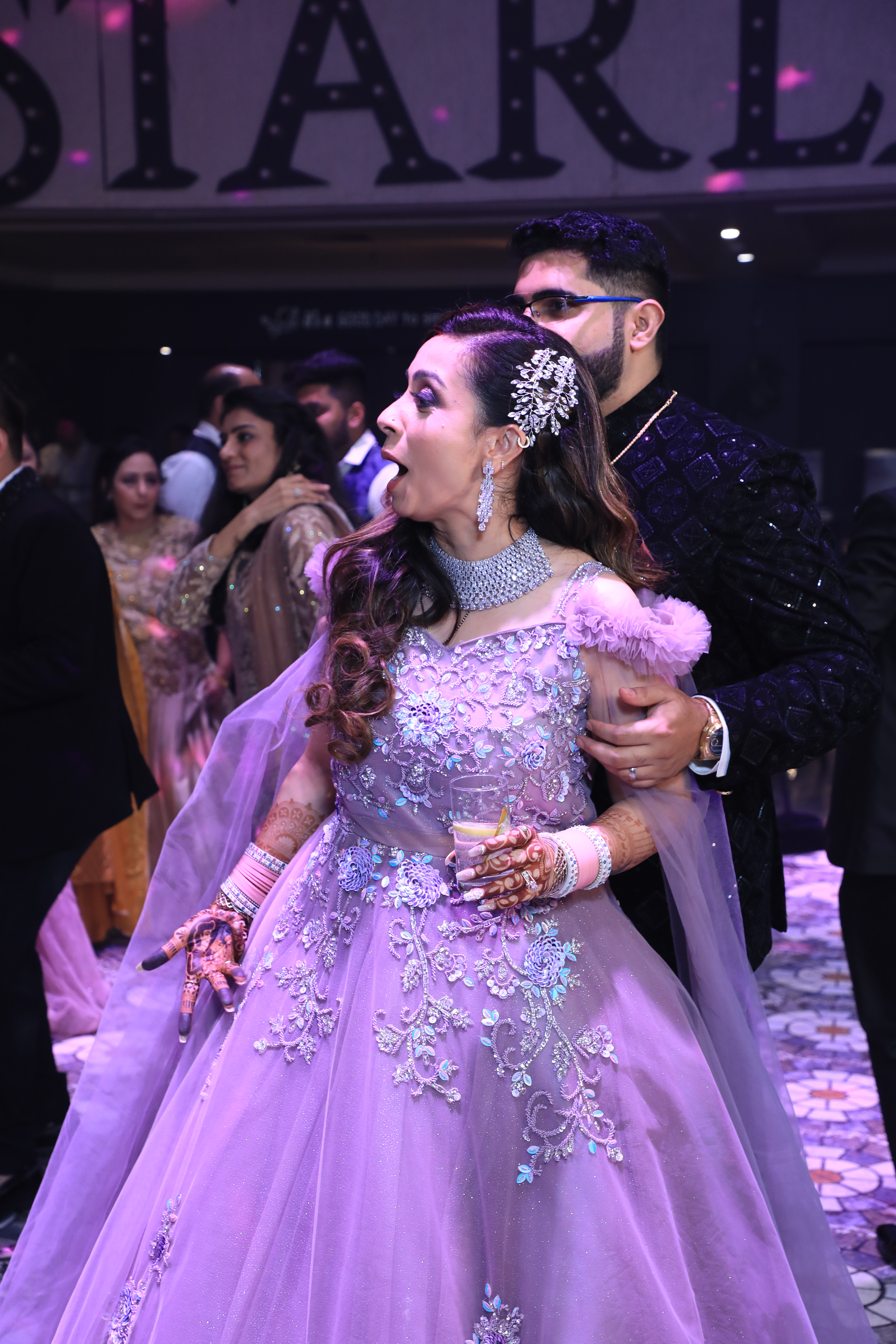 Bride dancing during wedding cocktail party