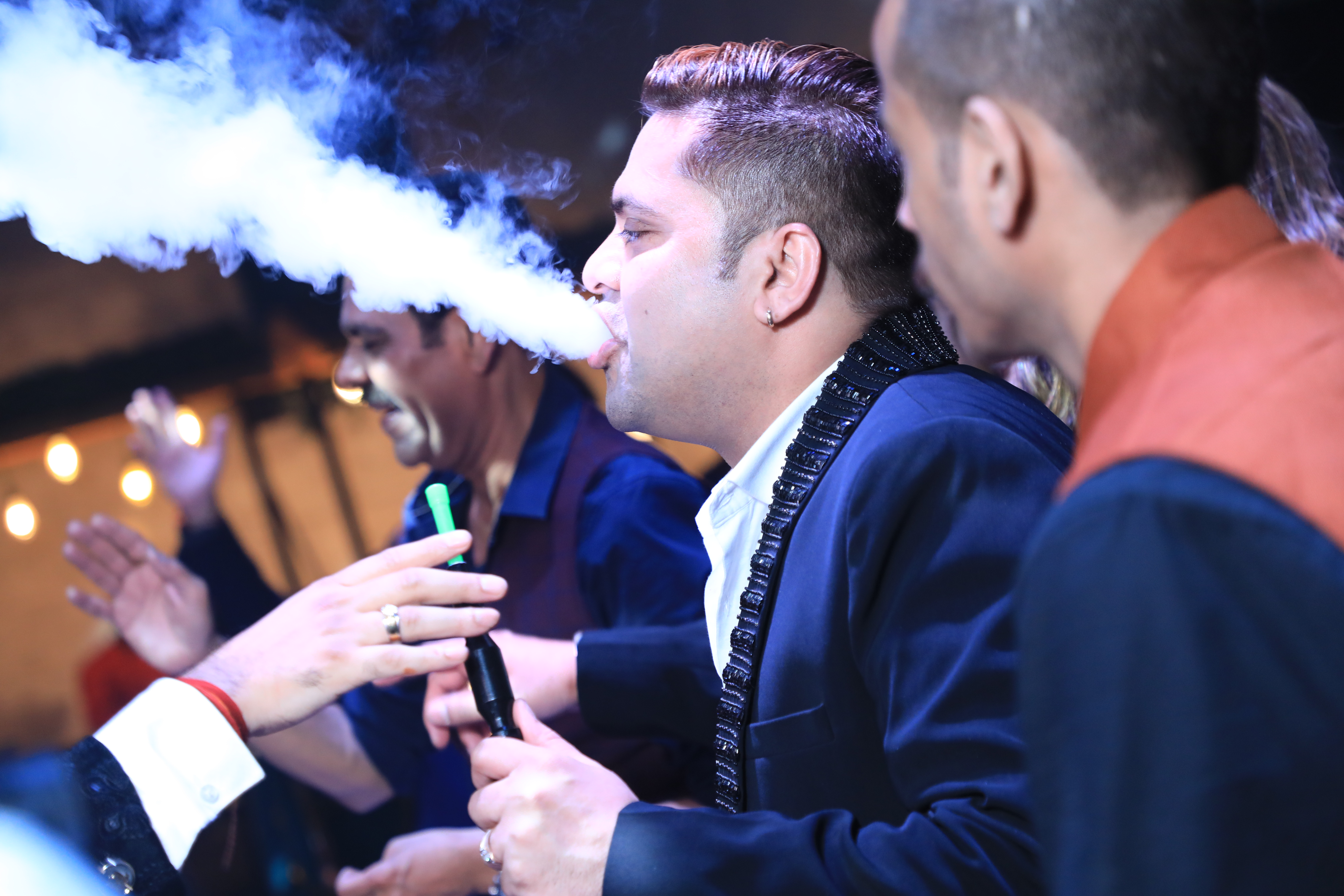 Candid wedding photography during cocktail night in Noida