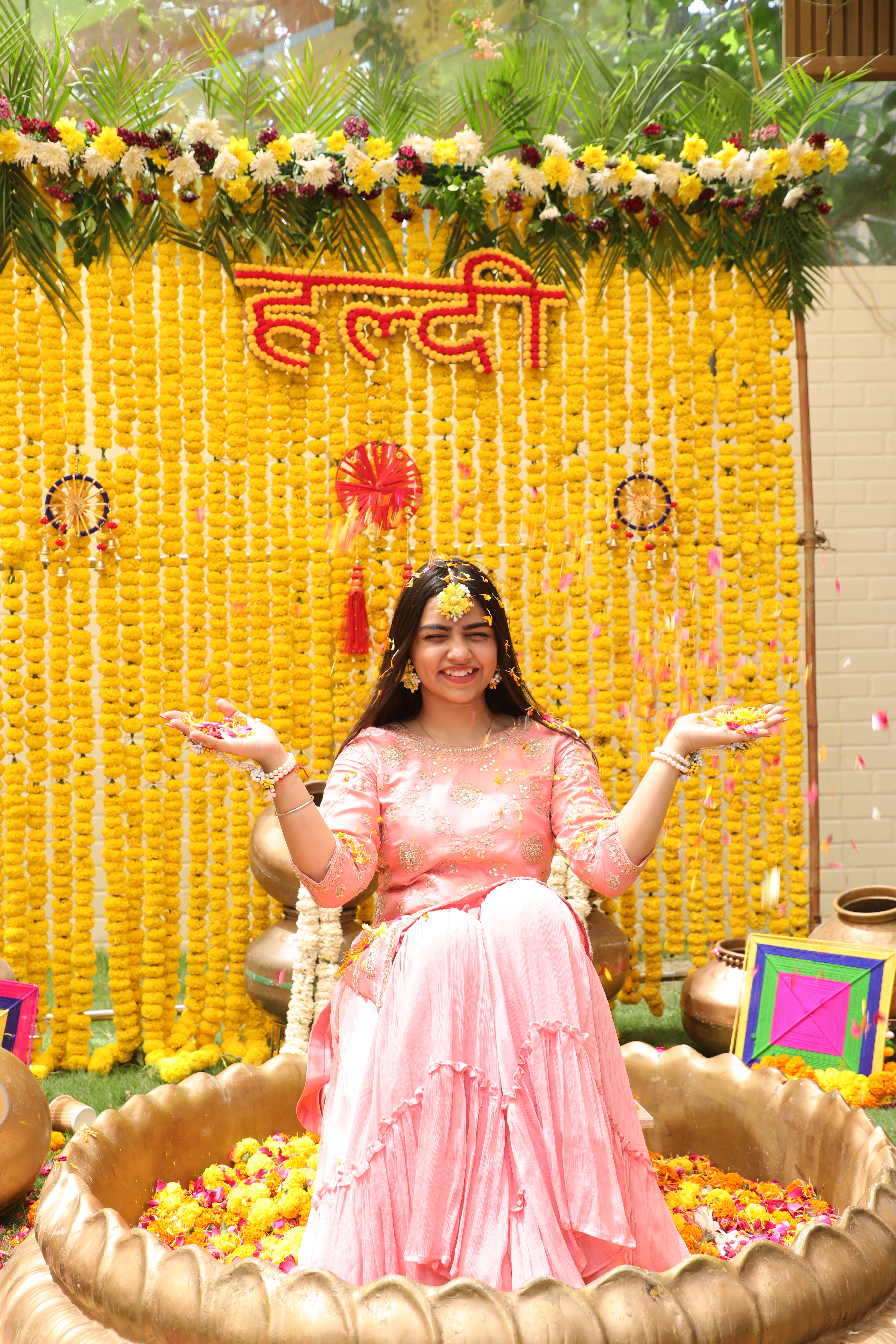 Bride portrait with colourful Haldi ceremony decoration