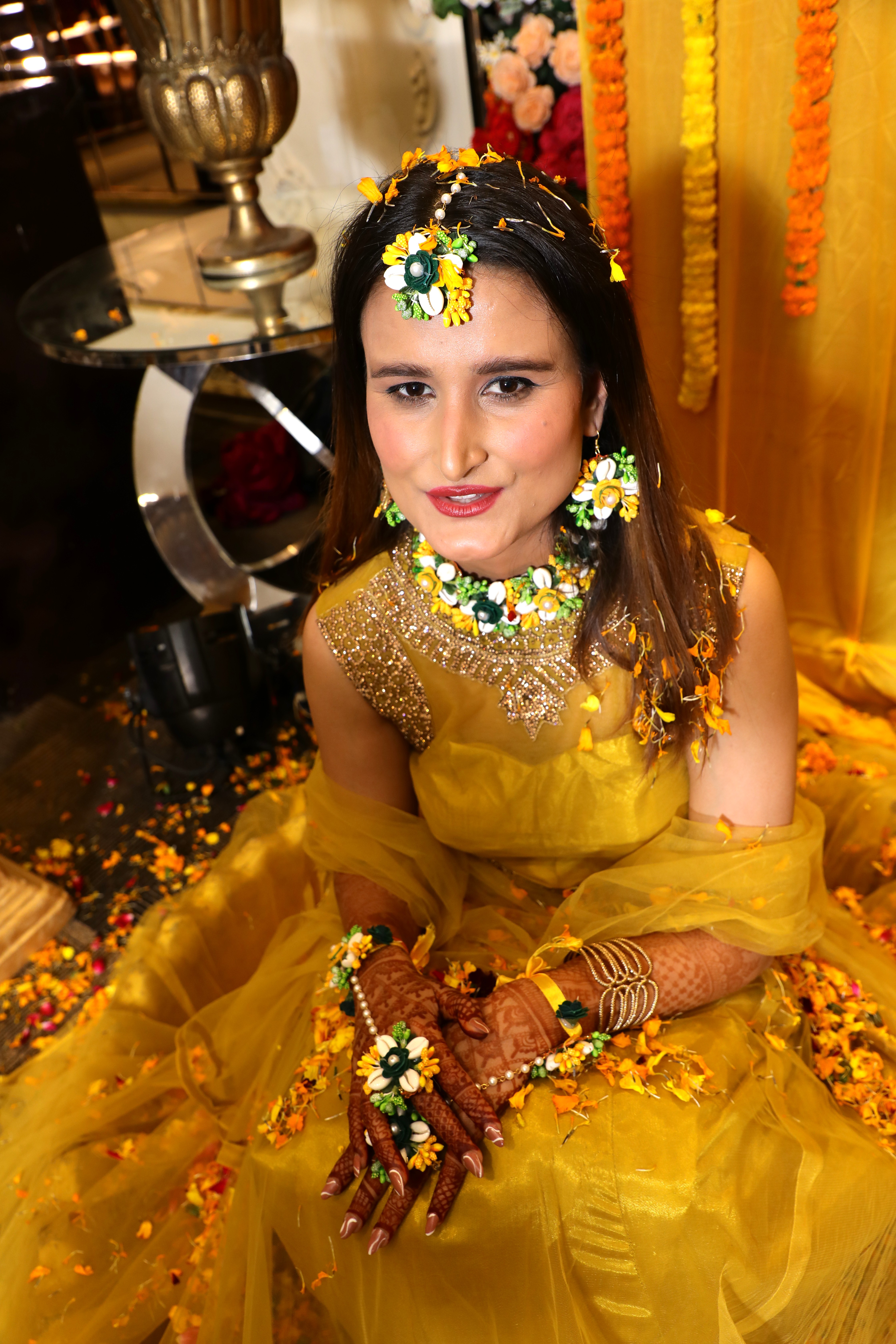 Family enjoying colourful Haldi ceremony celebration