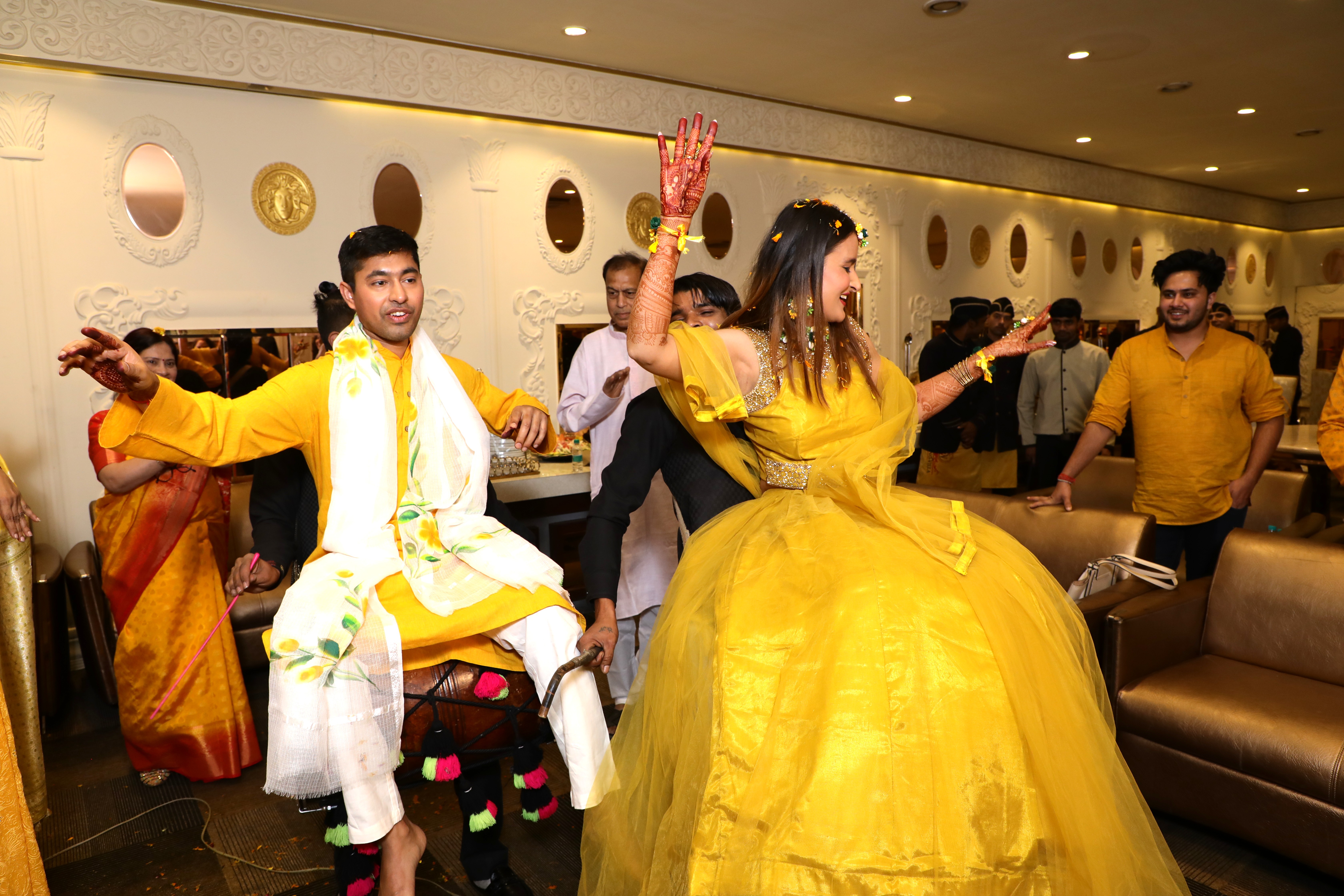 Candid expressions during traditional Haldi function