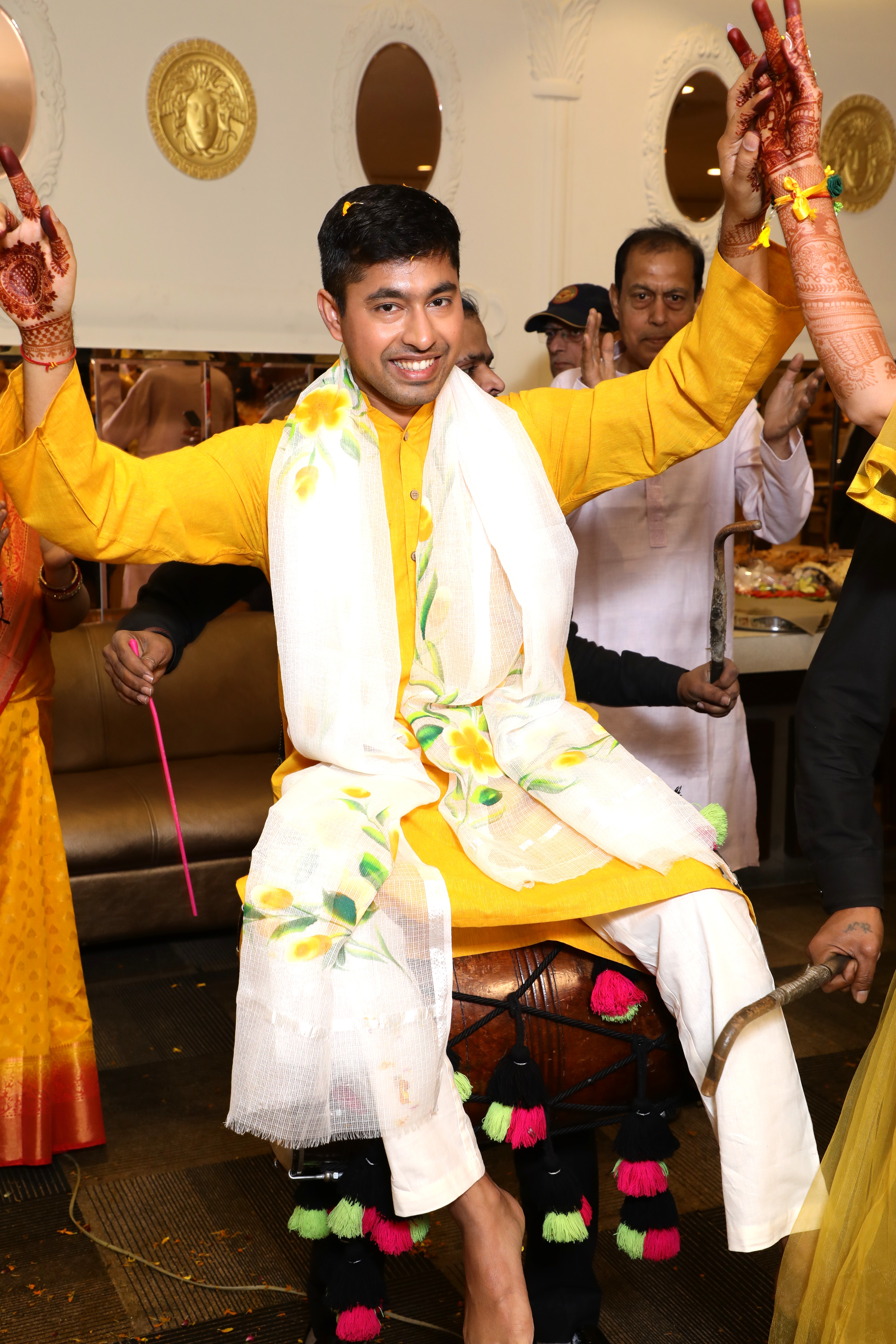 Bride and family sharing joyful Haldi moments